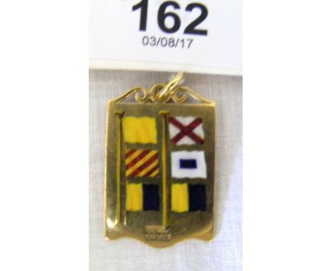 An 18ct gold and enamel "Undine 1922-32" pendant with enamel signal to the reverse