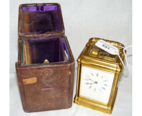 A brass cased French repeater carriage clock with white enamel dial and Roman numerals - 13cm complete with leather carrying 