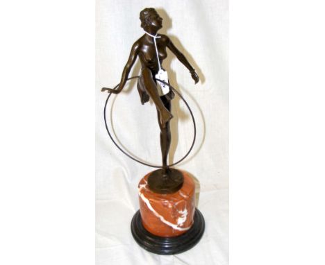An Art Deco style bronze figure of a hoop dancer on marble base - 47cm high overall