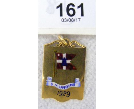 An 18ct gold and enamel "S.Y. Undine 1929" pendant