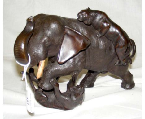 A finely cast bronze group of Elephant being attacked by two Tigers - 19cm high
