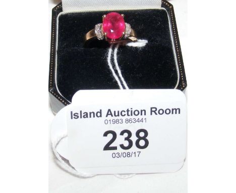 A 9ct yellow gold ruby and diamond ring