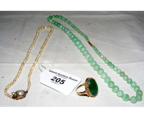 An apple jade graduated bead necklace with gold clasp, a pearl necklet and a 9ct gold oval jade ring