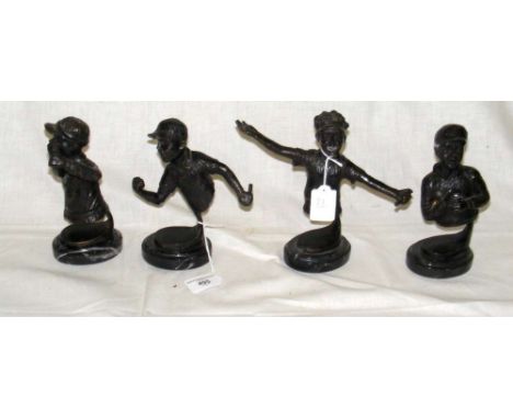 A set of four bronze busts of American baseball players on matching oval marble bases