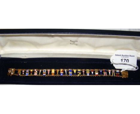 A 9ct gold and enamel bracelet mounted with numerous semaphore flags in Benzie of Cowes presentation case