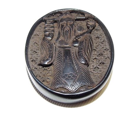 Japanese hardwood netsuke, of oval form carved in relief with a sage with trellis background to one side, the other side with