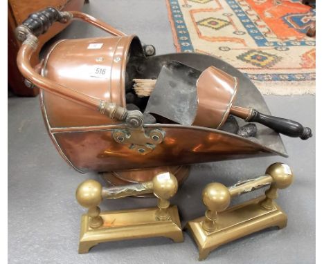 Copper coal helmet and scoop, together with a pair of brass fire dogs.