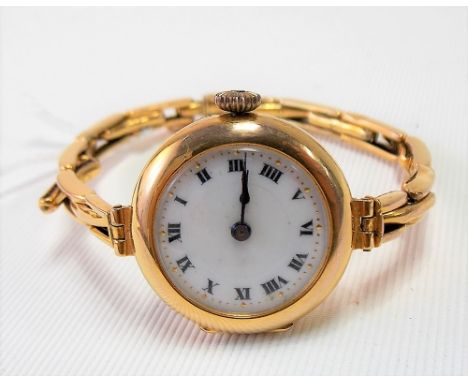 1920's/30's ladies 9ct gold manual wind wristwatch with circular white enamel dial &amp; 9ct gold expanding bracelet, weight 