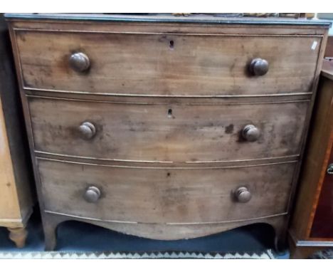 19th Century mahogany bow front chest of three long drawers upon outswept feet, width 100cm