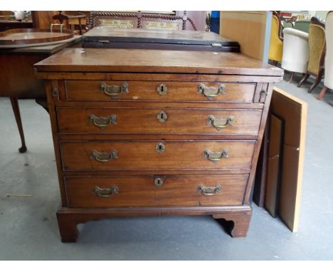 George III mahogany bachelor chest, the hinged top over two slide supports &amp; an arrangement of four graduated cock-beaded