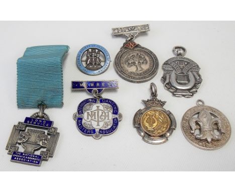 Seven various silver and silver and enamel medals, mostly music and drama-related, weight 2.20oz approx.