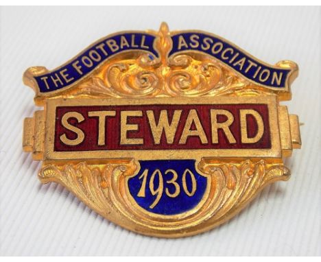 A 1930 Football Association 'STEWARD' badge, gilt metal &amp; enamel by Denton &amp; Down, 22 Ely Place, E.C.1, width 40mm