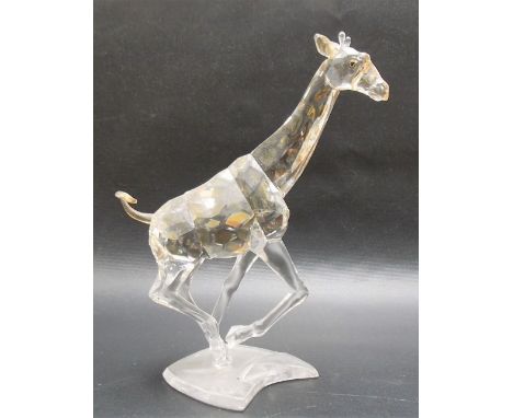 Swarovski crystal model of a giraffe, with gilt lustre spots, height 17cm.