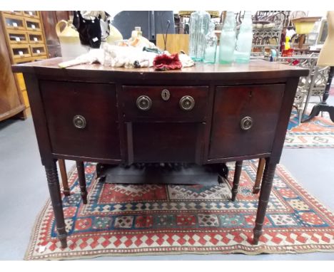 19th Century bow front sideboard with central drawer &amp; cushion drawer flanked by two large drawers on turned feet