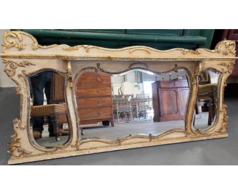 19th Century French lime washed and parcel gilt foliate gesso moulded shaped triple over mantel mirror, the central shaped mi