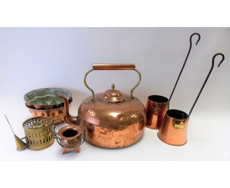 Seven copper and brass items, to include two jelly moulds, a large copper and brass kettle, two cider measures, brass chamber