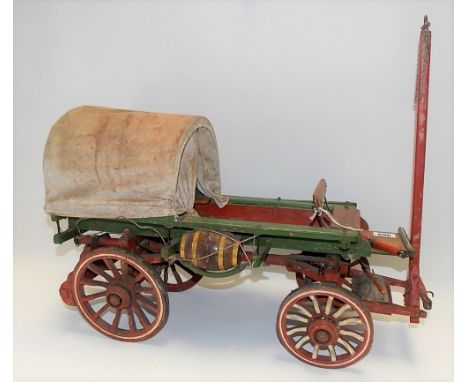 Painted wooden model of a prairie cart, length 86cm.