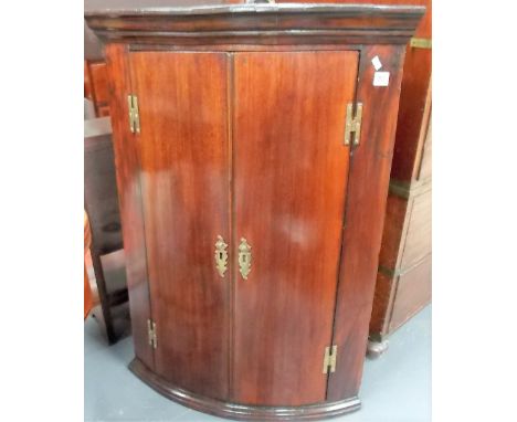 George III mahogany bow front wall hanging corner cupboard