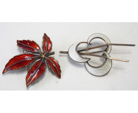Two Norwegian silver and enamel brooches.