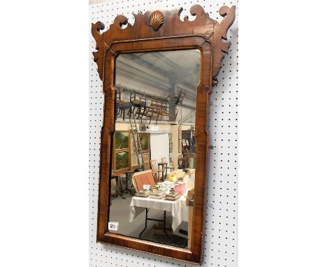 George III walnut veneered fret mirror, the scroll surmount with scallop shell applied motif, height 71cm