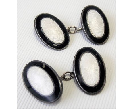 Pair of silver black and white guilloche enamel oval cufflinks.