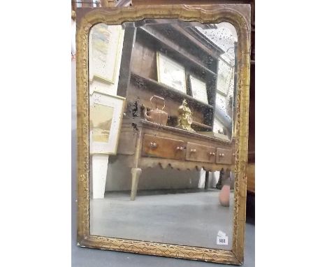 18th Century bevel edged gilt framed wall mirror, the mirror with shaped top, the frame gilt gesso moulded, height 72.5cm x w