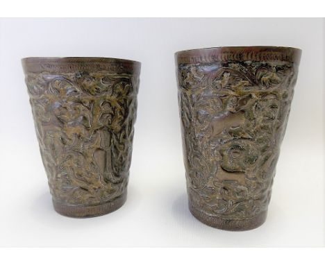 Pair of Indian enamel on copper embossed cups decorated with three figures, hounds &amp; deer amongst foliate scroll, height 