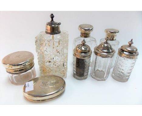 George V silver engine turned screw lid glass scent bottle by Asprey, London 1914 (lid misshapen) together with matching toil
