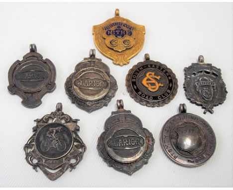 Six 1920's/30's cycling relating shield fob medals together with two base metal &amp; enamel cycling fobs