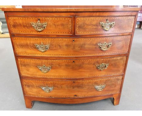 George III mahogany chevron strung bow front chest of two short over three long graduated drawers raised on bracket feet, wid