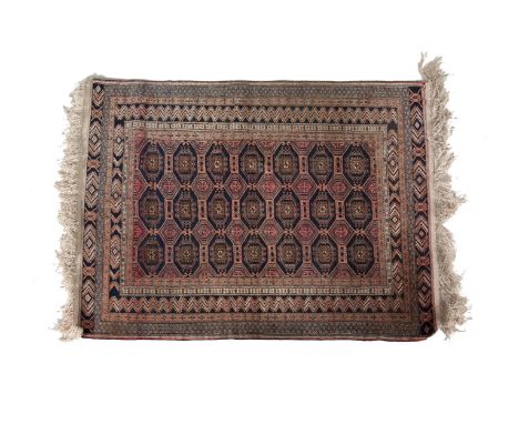 A BOKHARA WOOL RUG, the central field with multiple octagonal medallions on navy blue ground, within borders and guard stripe