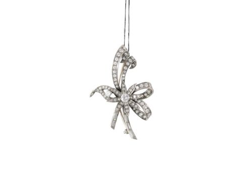 A DIAMOND FLOWER BROOCH, the brooch set with a central brilliant-cut diamond, within a surround of single and baguette-cut di