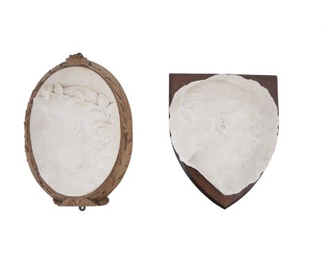 TWO CARVED CARRARA MARBLE MOUNTED RELIEF PANELS, comprising one signed 'M. Lawlor 1913' and contained with a carved oak surro