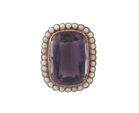 A VICTORIAN GEM-SET BROOCH, the large cushion-shaped amethyst within a frame of seed pearl, length 3.8cm
