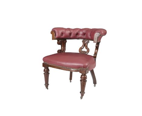 A VICTORIAN MAHOGANY AND BUTTON BACK UPHOLSTERED TUB BACK LIBRARY CHAIR, the padded seat covered in red hide and raised on fl