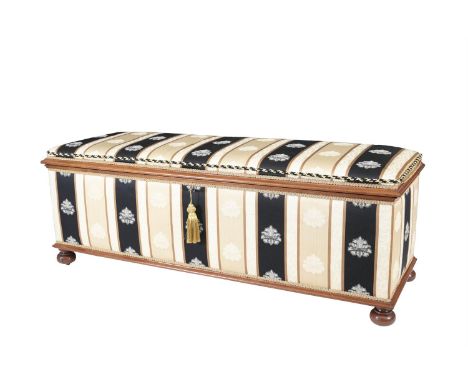 A 19TH CENTURY MAHOGANY FRAMED OTTOMAN, of rectangular form, with padded lift-top, the entire upholstered in gold and navy st