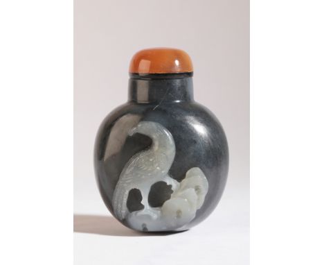 A CHINESE JADE SNUFF BOTTLE 19th century, the 'black' nephrite body carved to the front with an eagle perched on a rock, 6cm 
