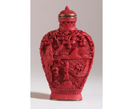 A CHINESE CINNABAR STYLE SNUFF BOTTLE bearing a four character Qianlong mark, with high shoulders and a lotus leaf decorated 