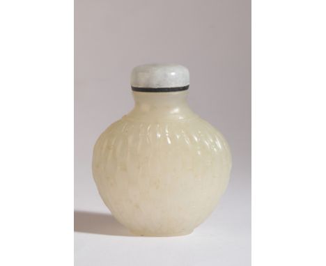 A CHINESE JADE SNUFF BOTTLE 18th/19th century, the white nephrite body carved all over with a basket weave pattern, narrow ro