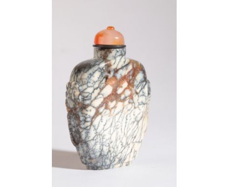 A CHINESE HARDSTONE SNUFF BOTTLE probably 19th century, the pale ground with dark 'veins' and inclusions, mask and ring handl