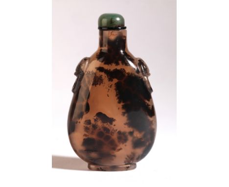 A CHINESE AGATE SNUFF BOTTLE 18th/19th century, with natural dark inclusions to one side giving the appearance of a small bir