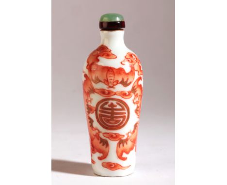 A CHINESE PORCELAIN SNUFF BOTTLE Daoguang seal mark and period, decorated in red enamel with a central Shou symbol amongst cl