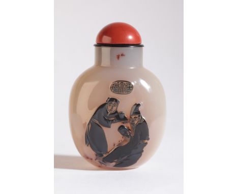 A CHINESE AGATE SNUFF BOTTLE 19th century, the front carved to the dark grey skin with a female attendant serving a drink to 