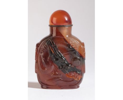 A CHINESE AGATE SNUFF BOTTLE 19th century, of square form with a carved coiled dragon to one side and two birds to the revers