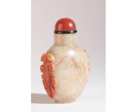 A CHINESE JADE SNUFF BOTTLE 18th/19th century, of pale green colour with russet carved lingzhi decoration to the sides, 6.5cm