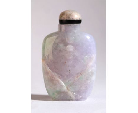 A CHINESE JADEITE SNUFF BOTTLE late 19th century, the apple green and lavender stone carved to one side with two confronting 