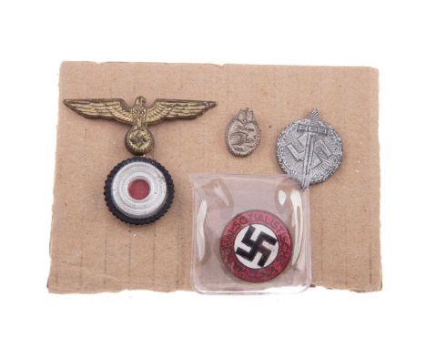 FOUR WWII THIRD REICH BADGES,comprising NSDAP party member's badge, a cockade surmounted by eagle, a small Panzer badge, and 