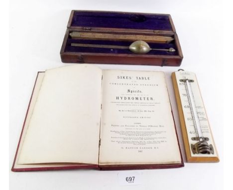 A Sikes Hydrometer and table of Spirits book, together with a Flowers of Stratford thermometer