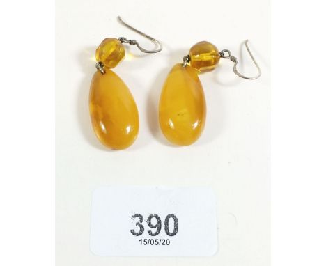 A pair of silver and amber pendant earrings