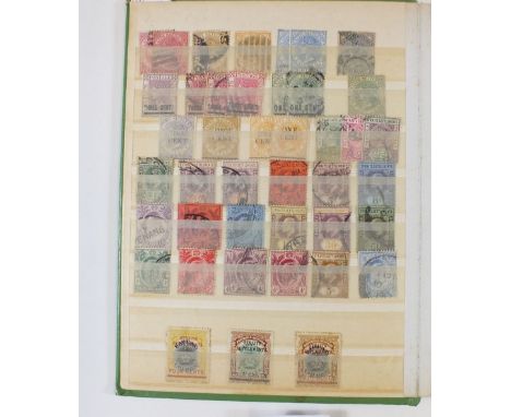 A green stockbook of Malaya stamps, mint and used, Strait Settlements and other states including KGV Silver Jubilee, higher v